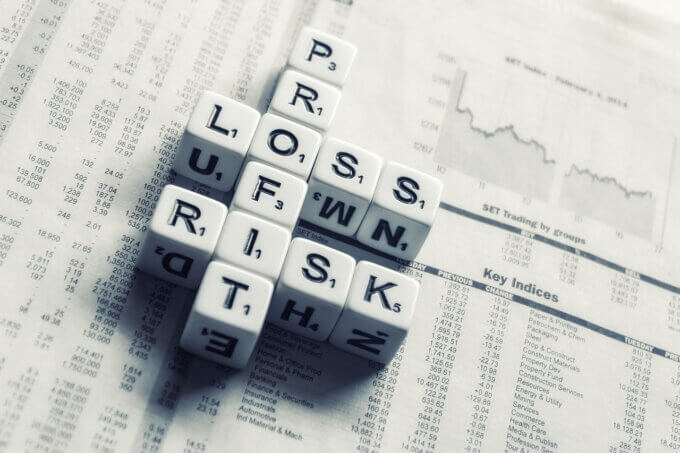 dices over newspaper, profit, loss risk-2656028.jpg